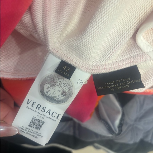 Versace sweater. Orange and pink. It’s like a woman small. - Picture 5 of 5